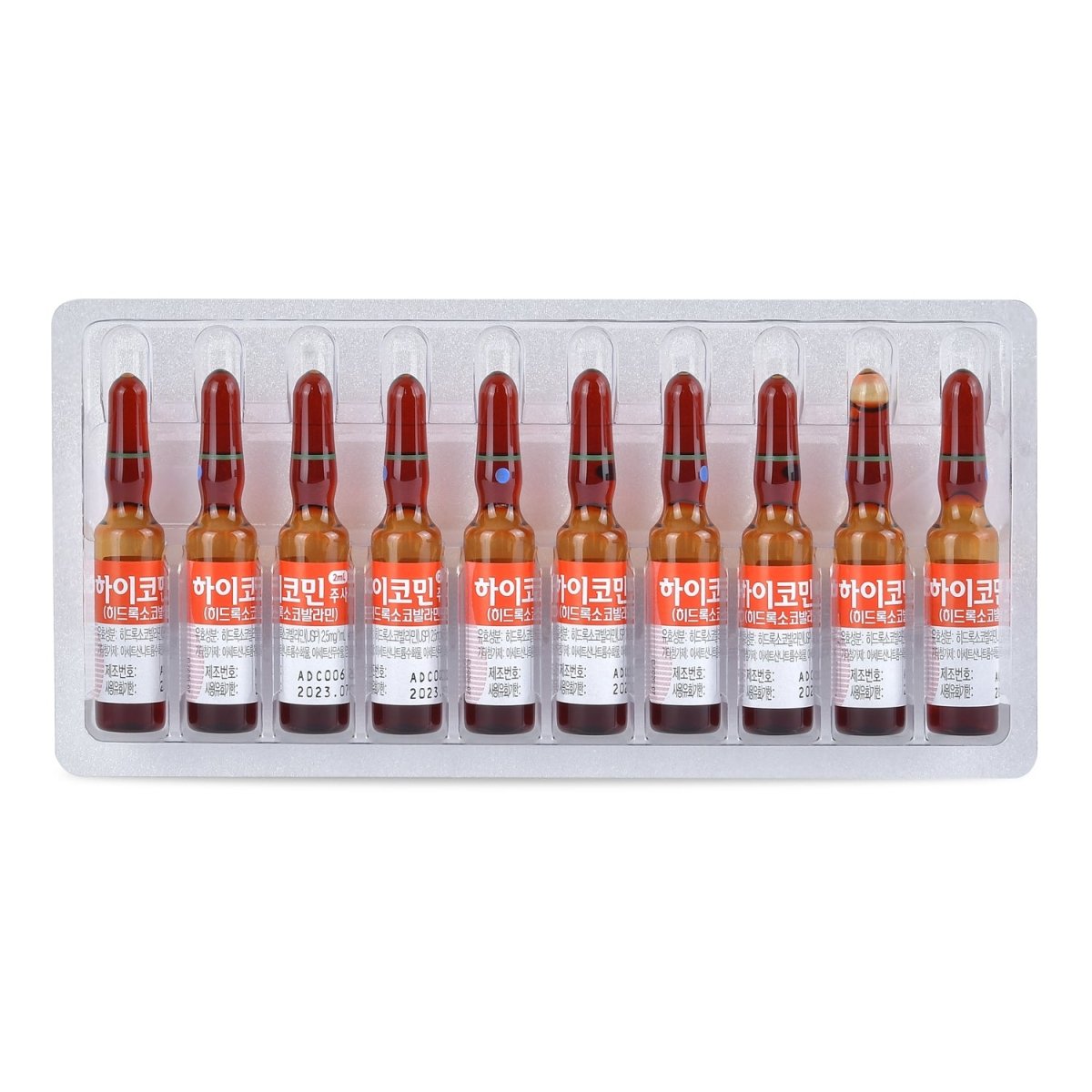A blister pack of ten amber glass ampoules of Hycomin Vitamin B-12 concentrate.