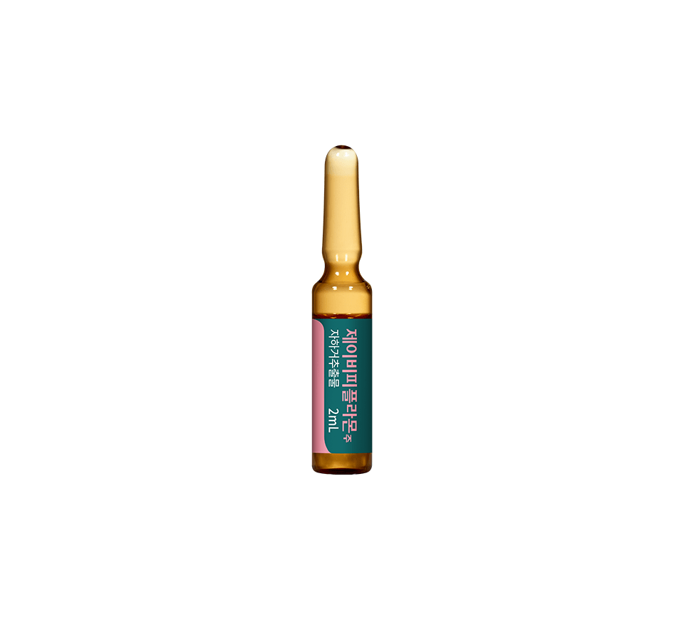 An amber glass ampoule with a green and pink label featuring Korean text.