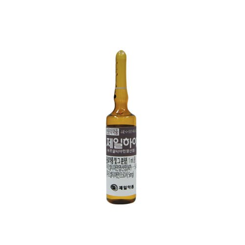 Brown glass ampoule with a white label featuring Korean text.