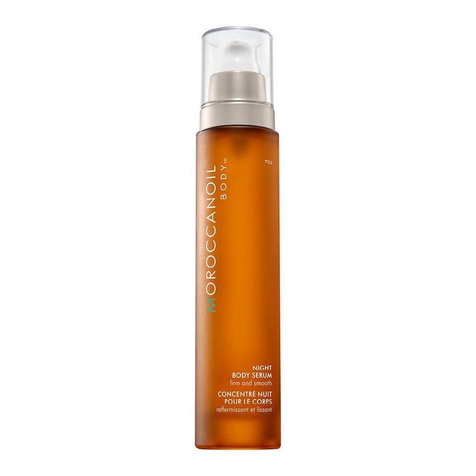 MoroccanOil Night Body Serum in an amber pump bottle with a clear cap.