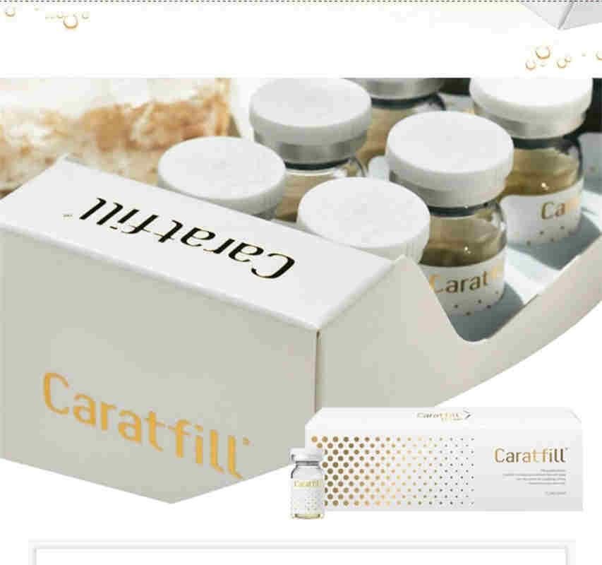 A white box of Caratfill Skinbooster vials, with more vials in the background.