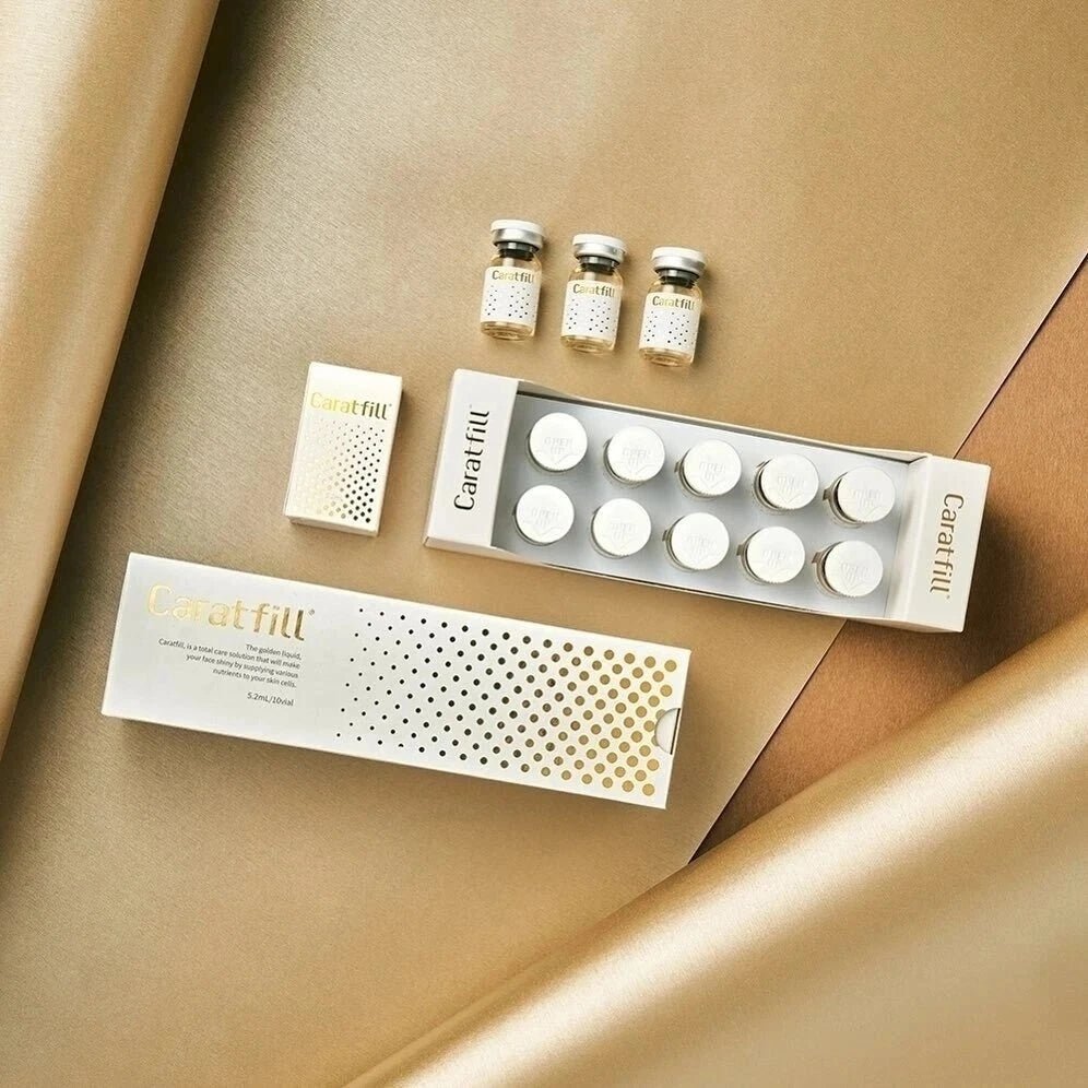 Caratfill Skinbooster vials and boxes are arranged on a gold and beige background.