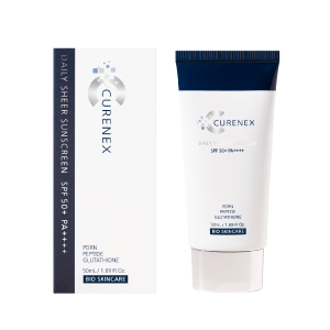 A white tube of Curenex Daily Sheer Sunscreen next to its white and dark blue box.