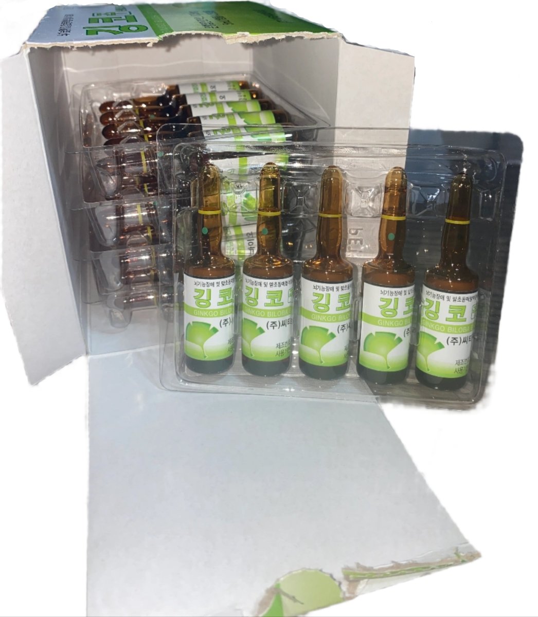 A box of Ginkgo Biloba liquid extract ampules, with five visible in the foreground.