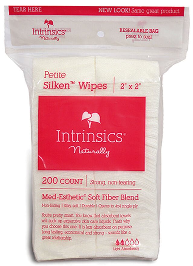 A clear plastic bag of Intrinsics Petite Silken Wipes, 200 count, 2" x 2".