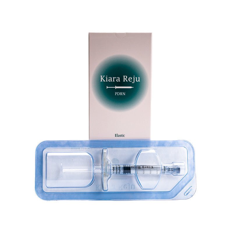 A Kiara Reju PDRN syringe in a clear plastic tray with its pink and green box.