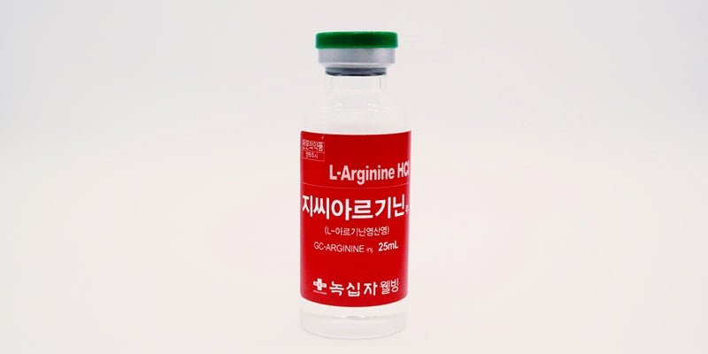 A clear vial with a green cap and a red label for L-Arginine HCl.