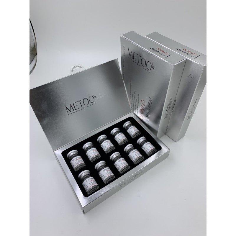 A silver box of Metoo Healer PDRN Booster with 10 vials, next to two closed boxes.