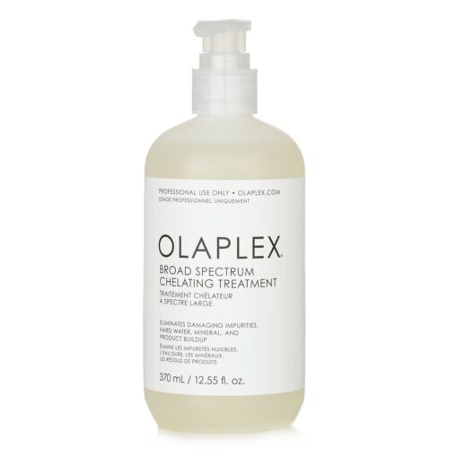 Olaplex Broad Spectrum Chelating Treatment in a white pump bottle.