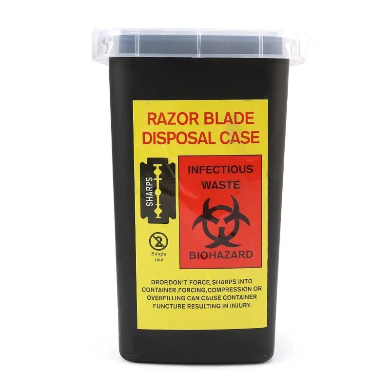 A black sharps container with a yellow and red label for razor blade disposal.